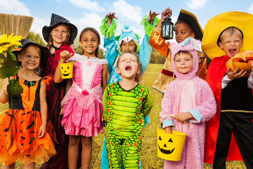 A group of children in different Halloween costumes