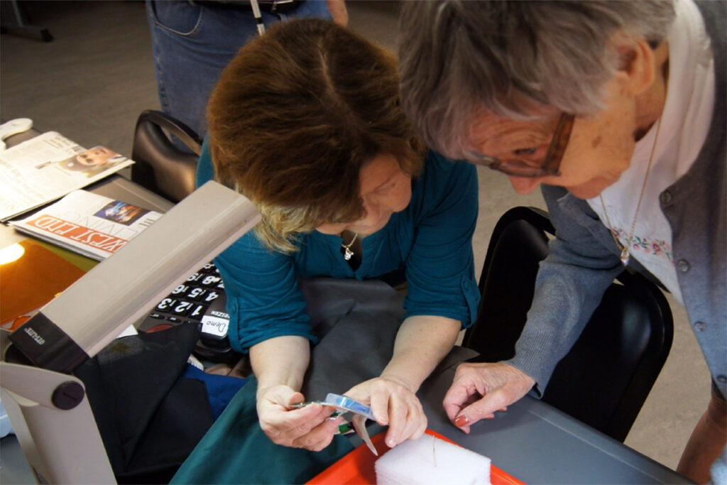 Photo of a vision rehabilitation therapist working with a client