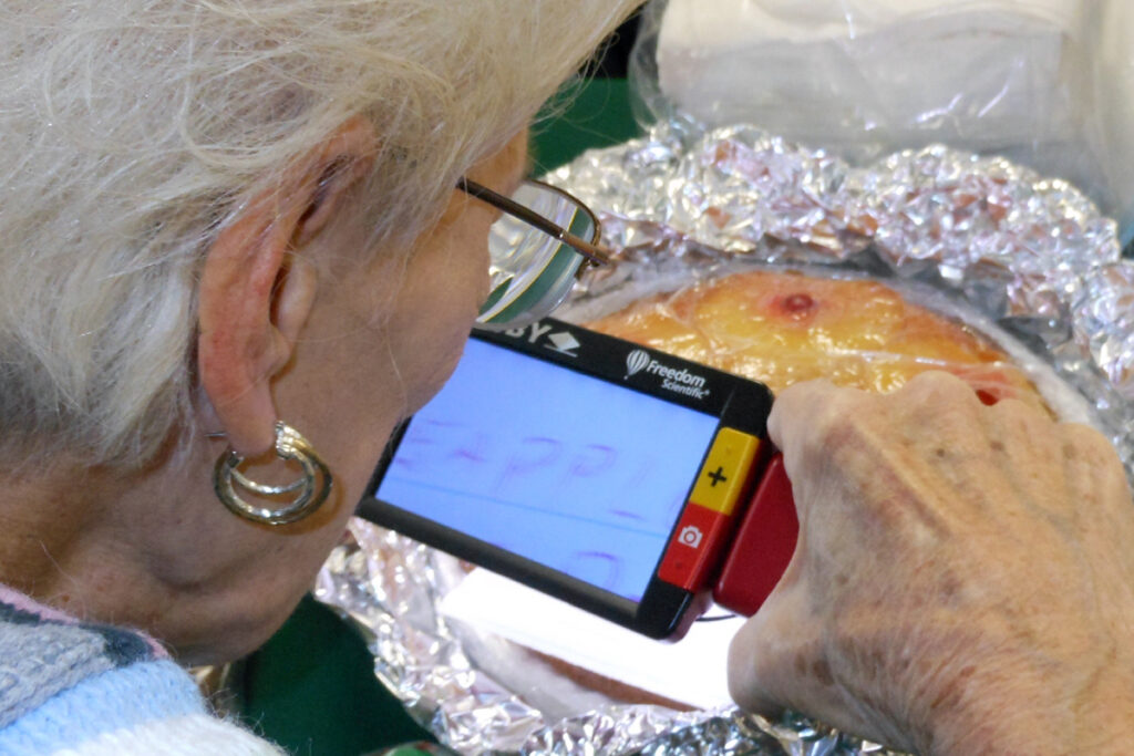 A client using a Ruby magnifier