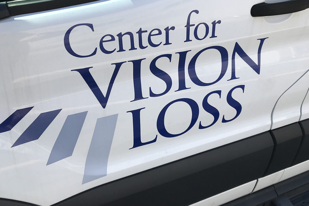 The Center for Vision Loss logo of the side of a van