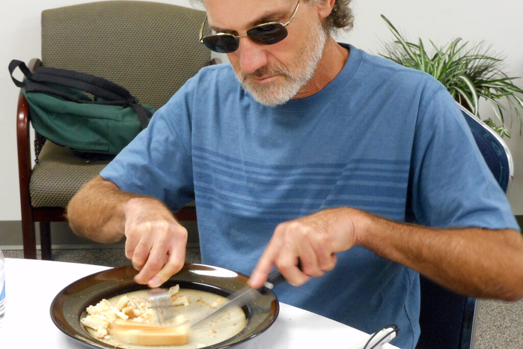 Photo of a male client as he learns how to dine successfully