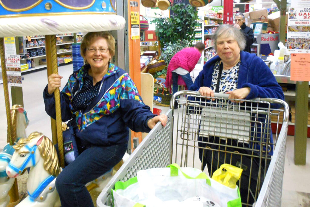 Photo of a female client and a female volunteer