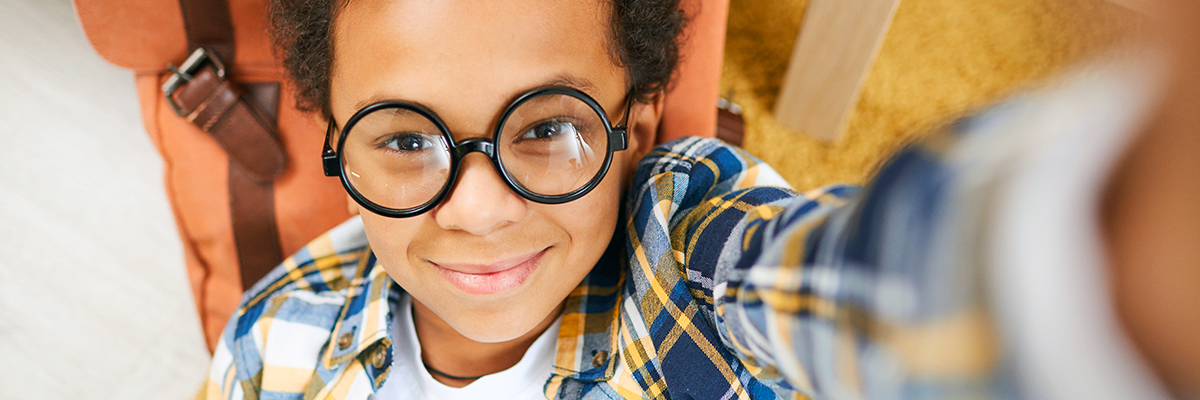 Photo of a little boy with eyeglasses