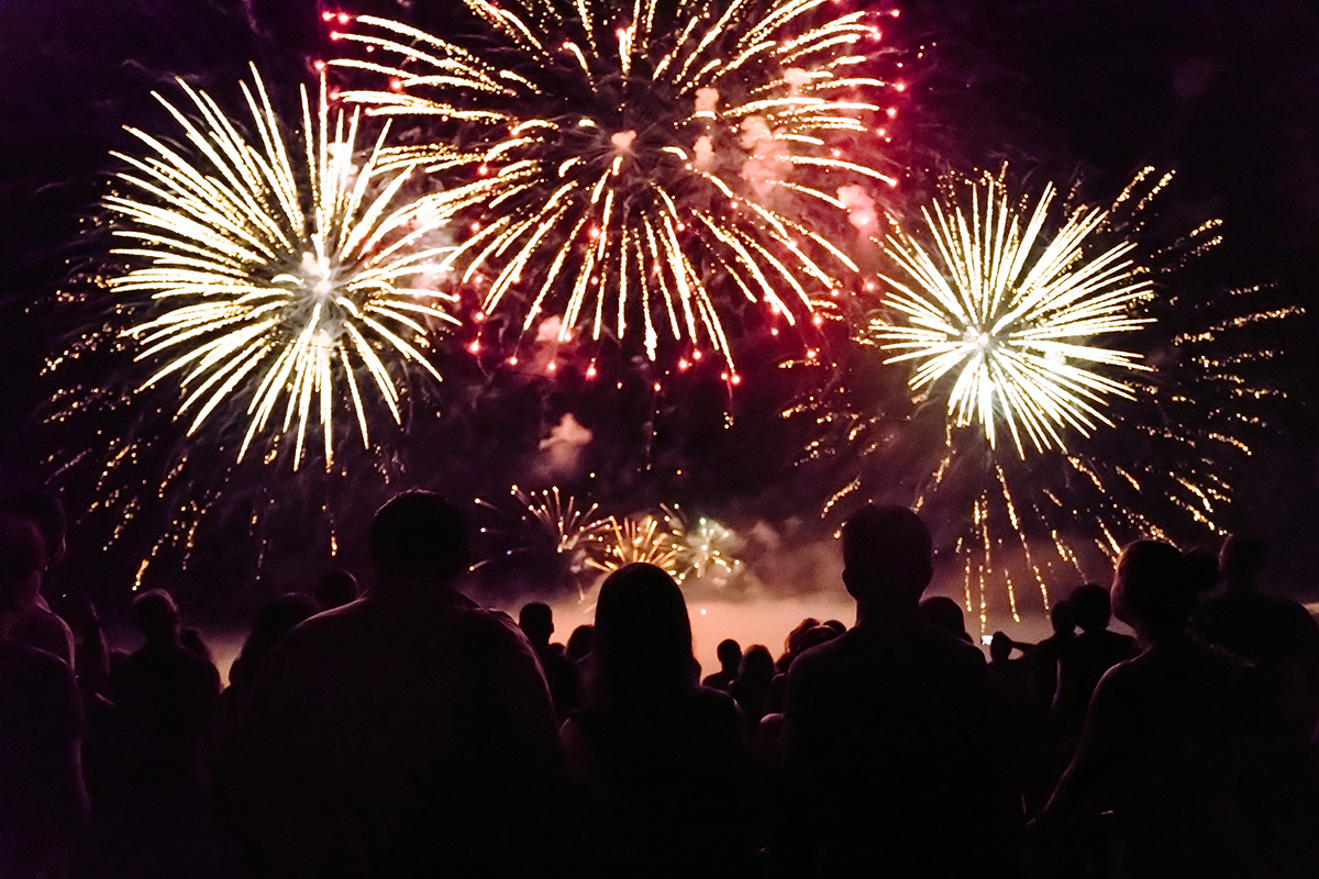 Image of a crowd watching a fireworks show