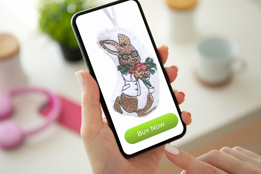 Photo of the C. Well Bunny Ornament, as shown on a person's smartphone