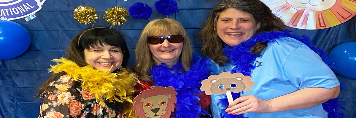Three members of the Monroe Sights for Hope Lions Club