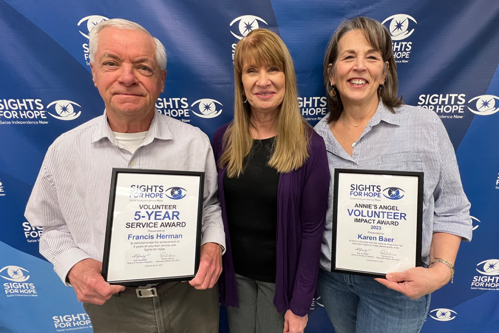 Two volunteer honorees with Rita Lang, Sights for Hope's Client Activities Manager